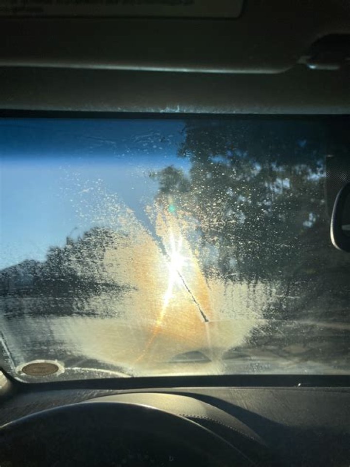How do I clear my windshield in the morning?