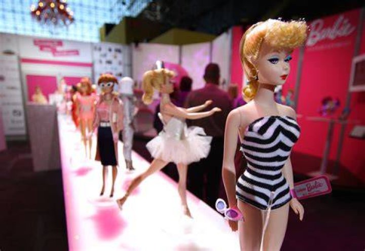 What does Barbie represent in society?